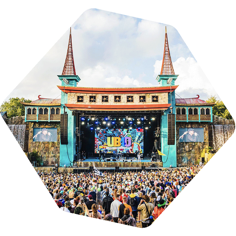 Photo of a crowd in front of a stage at Boomtown festival