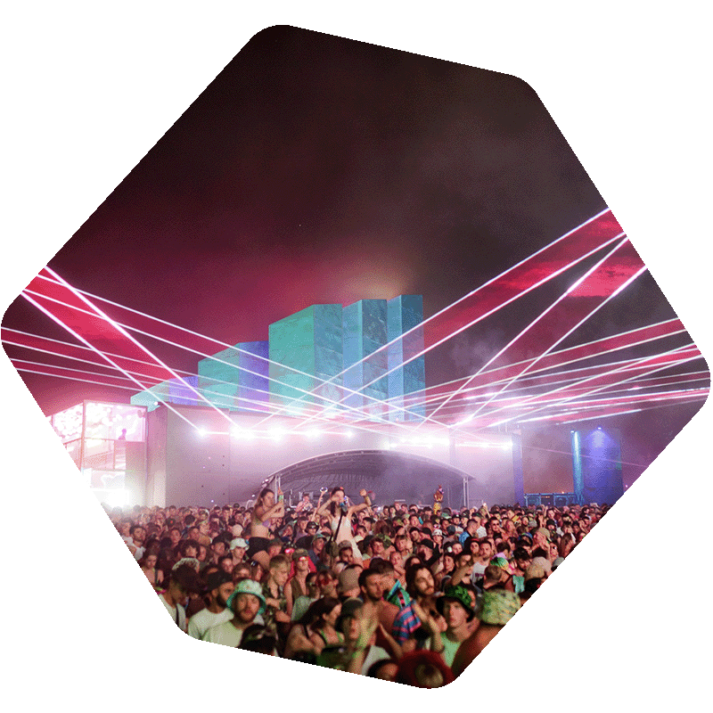 Photo of a crowd in front of a stage with laser lights