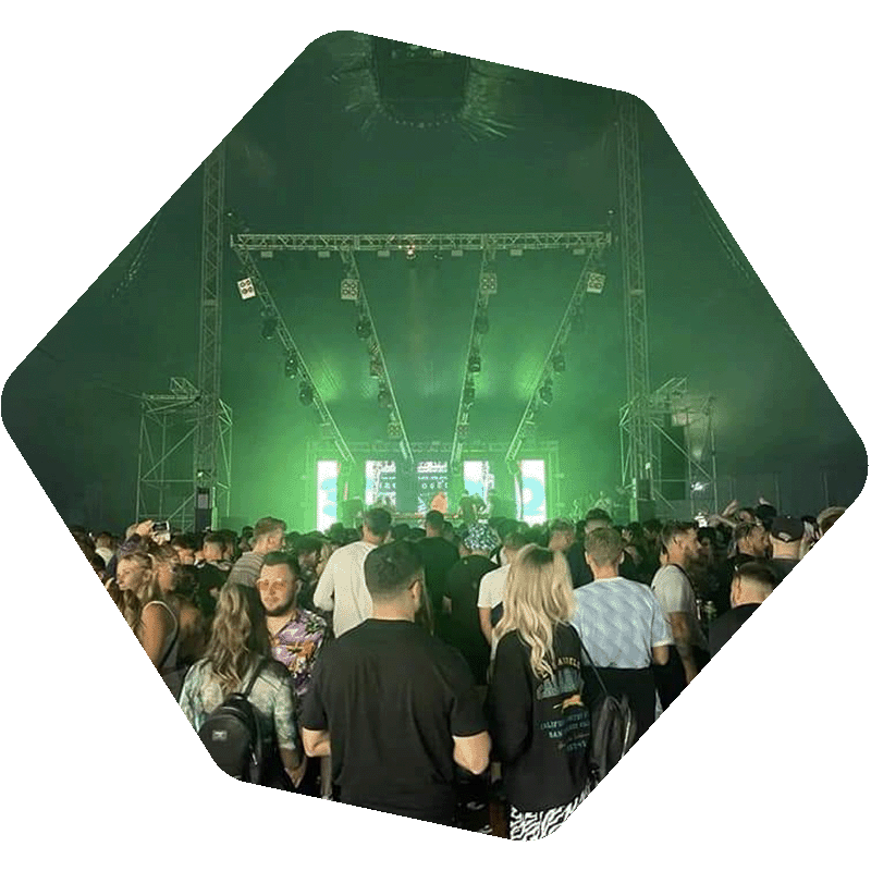 Photo of a crowd in front of a stage