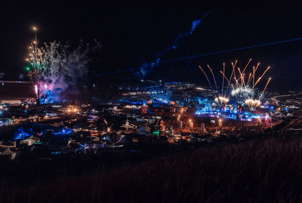 Festival site at night with fireworks